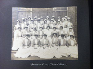 Photograph of a graduating class of nurses from St. Vincent's School of nursing. They are wearing uniforms with caps